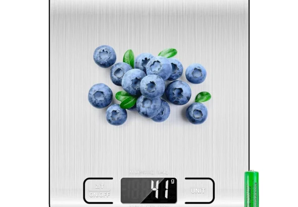 Etekcity digital kitchen food scale with stainless steel surface measuring blueberries in grams on LCD display