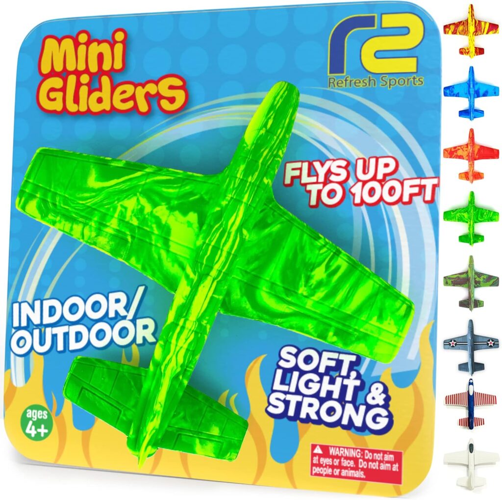 Bright green foam mini glider airplane toy on packaging labeled “Mini Gliders,” suitable for indoor and outdoor play, flies up to 100 ft, ages 4 and up