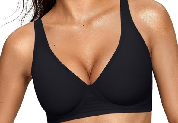 Woman wearing a black deep V wireless bra with wide straps and light support.