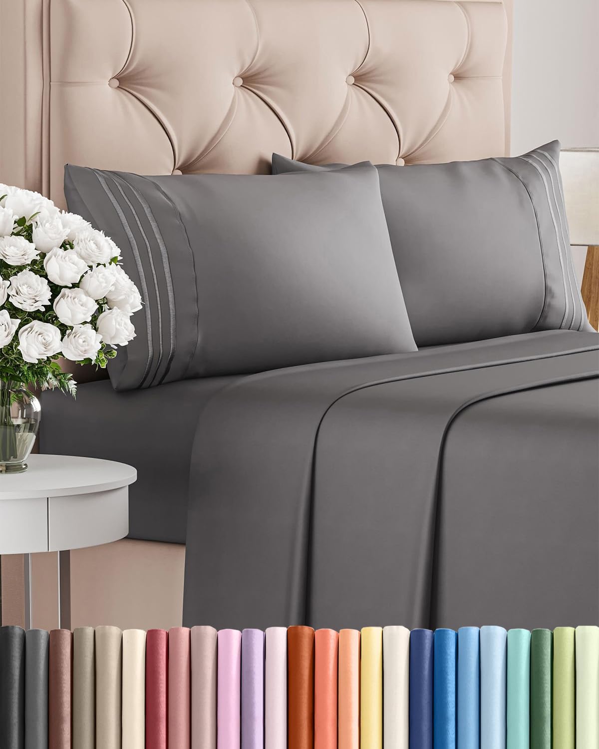 Dark grey queen-size bed sheet set with pillowcases on a tufted beige headboard, styled with a bedside table and white flowers; color options displayed below.
