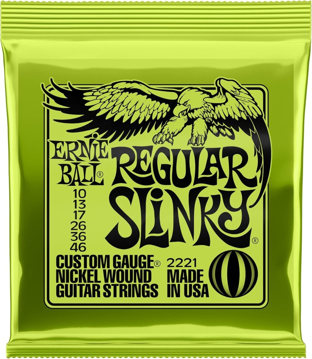 A pack of Ernie Ball Regular Slinky electric guitar strings in a bright neon green foil wrapper featuring a black eagle graphic.