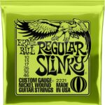 A pack of Ernie Ball Regular Slinky electric guitar strings in a bright neon green foil wrapper featuring a black eagle graphic.