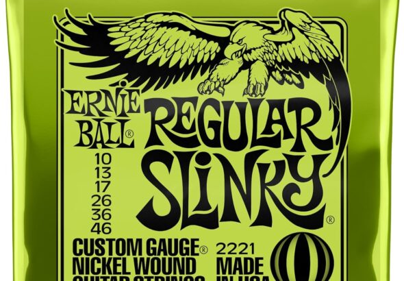 A pack of Ernie Ball Regular Slinky electric guitar strings in a bright neon green foil wrapper featuring a black eagle graphic.