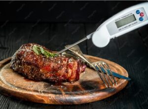 Best meat thermometers comparison showing ThermoPro, Lavatools, MEATER Plus, and Thermapen ONE instant read and digital meat thermometers