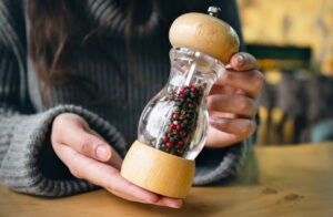 Best pepper grinders comparison showing manual and electric pepper mills from Peugeot, OXO, and Cole & Mason