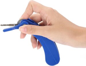 Key turner clipped onto a house key on a wooden table