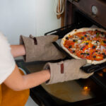 Best oven mitts comparison showing heat-resistant mitts from OXO, KitchenAid, and Grill Armor