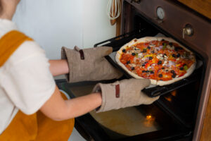 Best oven mitts comparison showing heat-resistant mitts from OXO, KitchenAid, and Grill Armor