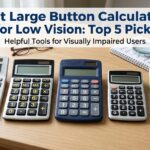 Five large button calculators lined up on a desk with glasses and a magnifying glass
