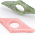 Two marbled thumb ring page holders, green and pink, for one-handed reading