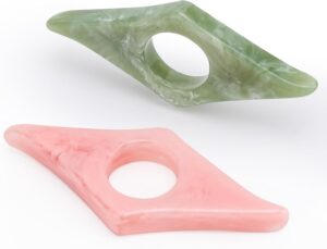 Two marbled thumb ring page holders, green and pink, for one-handed reading