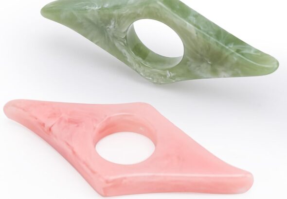 Two marbled thumb ring page holders, green and pink, for one-handed reading