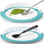 Plate with raised teal rim guard, spoon scooping peas against the edge