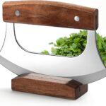 Rocker knife with curved blade cutting food on a plate