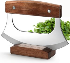 Rocker knife with curved blade cutting food on a plate